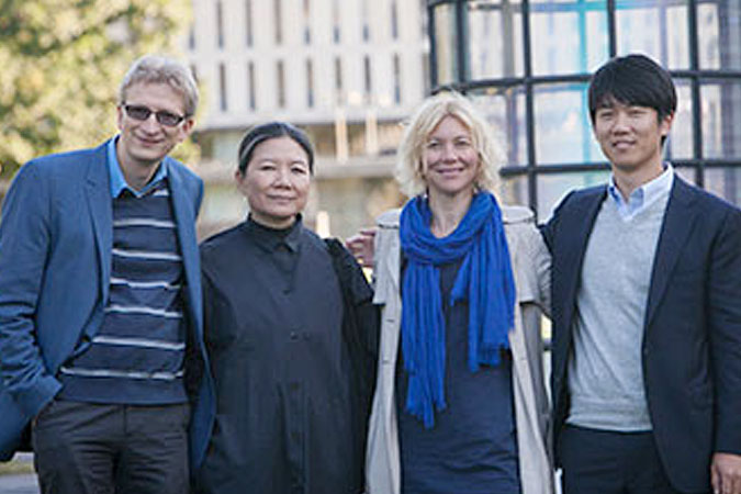 Materials science and engineering professor Uli Wiesner, artist Kimsooja, CCA Director Stephanie Owens and architect Jaeho Chong with Kimsooja's "A Needle Woman" after its installation on the Arts Quad in September.